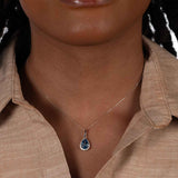 Pear Shape Blue Topaz and Diamond Halo Pendant, 14K White Gold