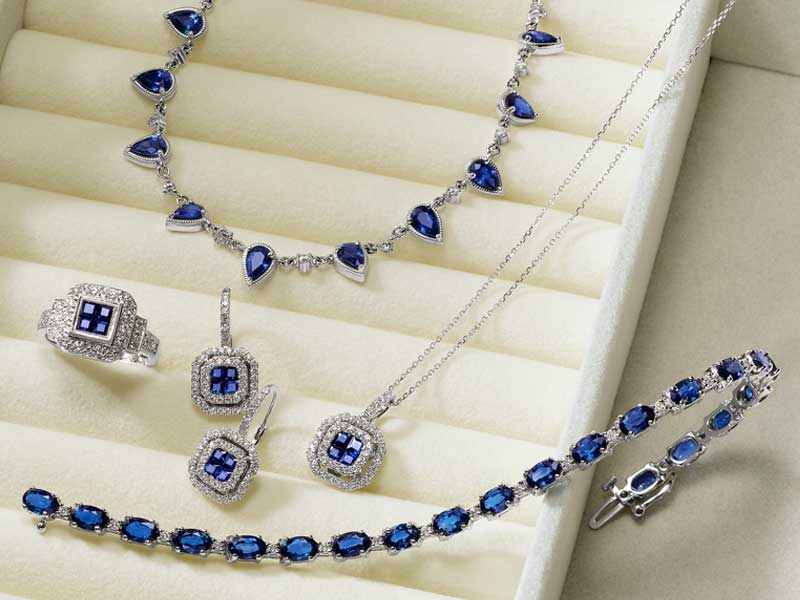 Blue sapphire and diamond necklace, earrings, ring and bracelet in white gold