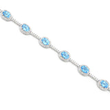 Blue Topaz and Diamond Halo Bracelet, 14K White Gold