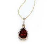 Pear Shape Garnet and Diamond Halo Pendant, 14K Yellow Gold